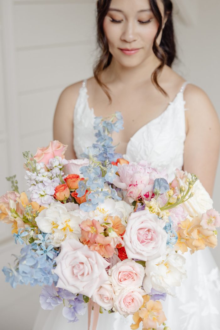 bride against a white wall
