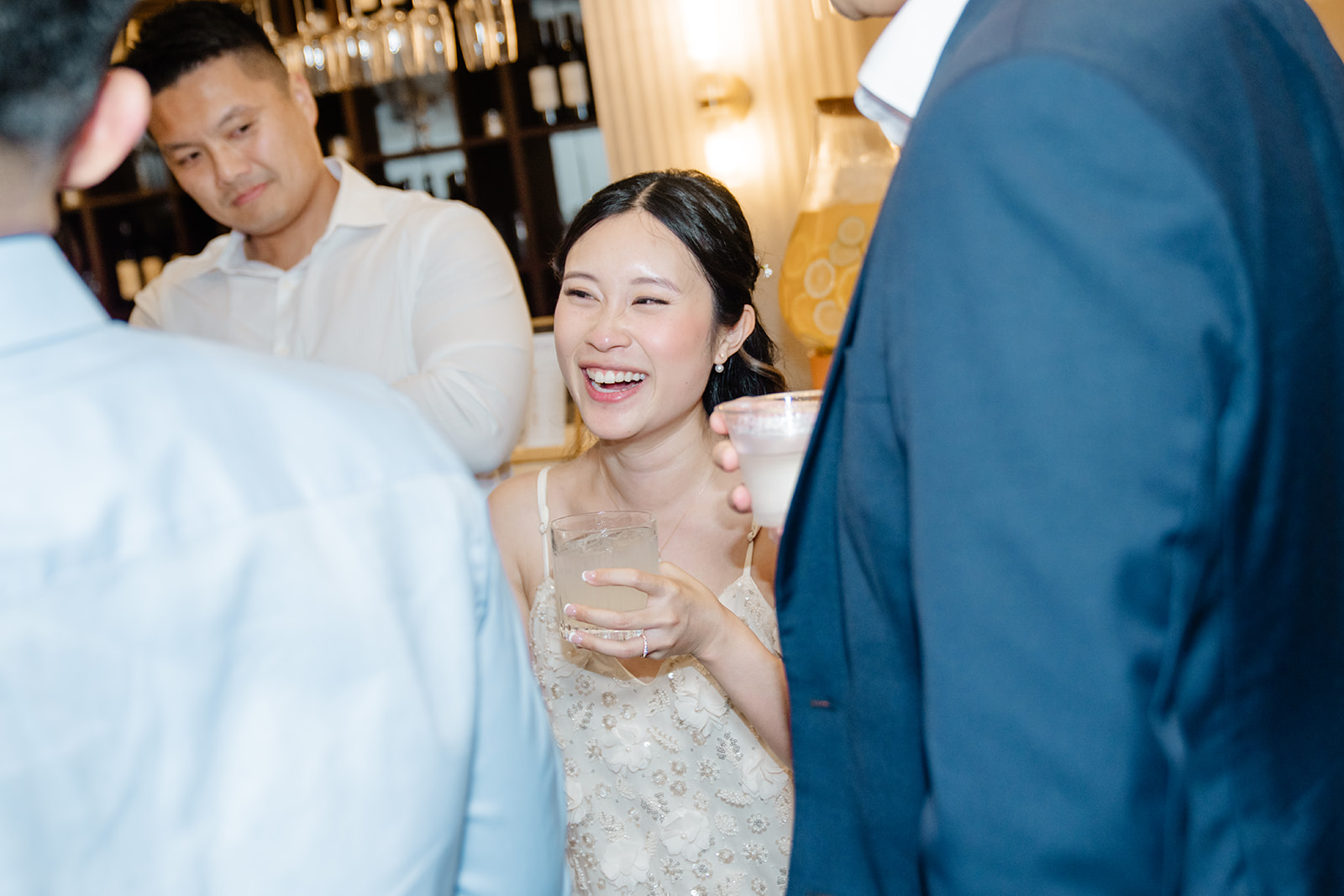 bride laughs with guests